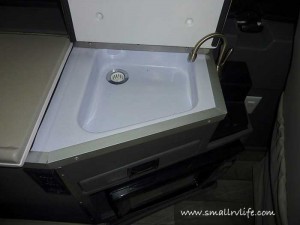 Hidden sink and foldup faucet